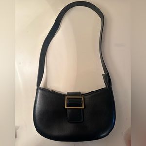 This is a black satchel bag from Brandy Meville.